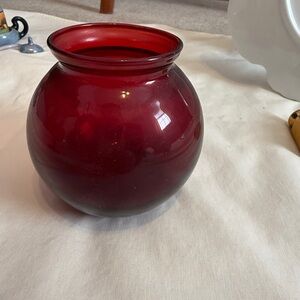 A vintage ruby red glass vase, likely mid-century.